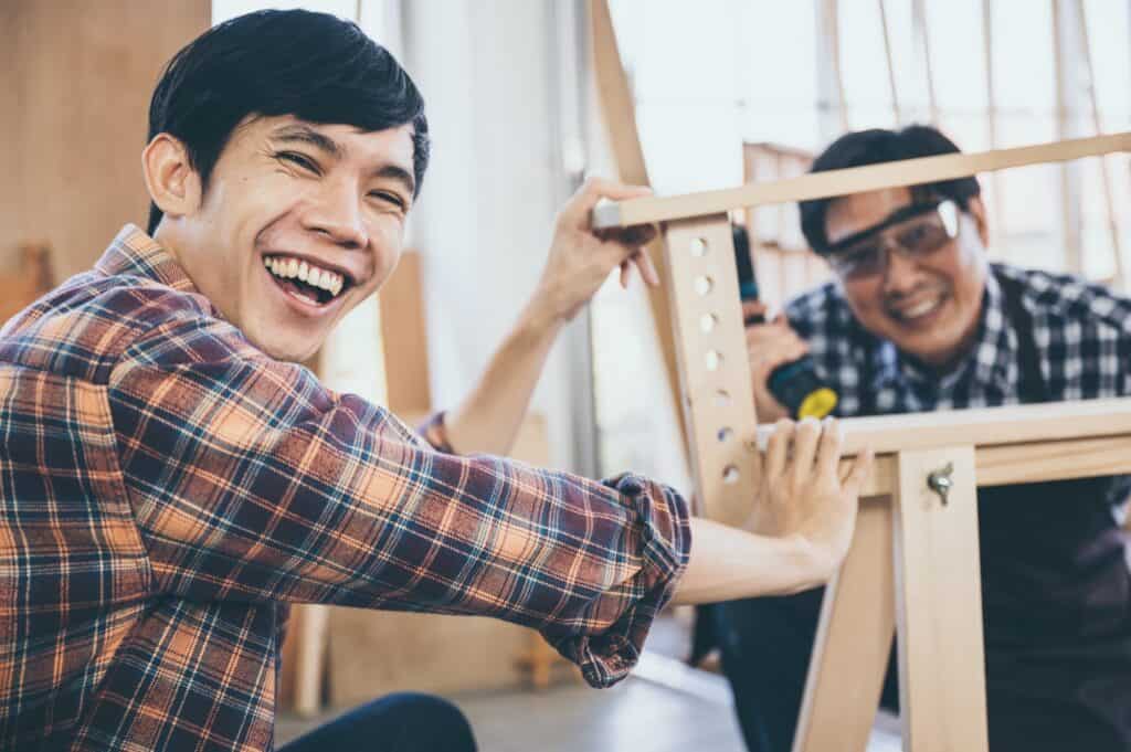 Carpenters team work together creatively, creative carpenter working with wood and tools