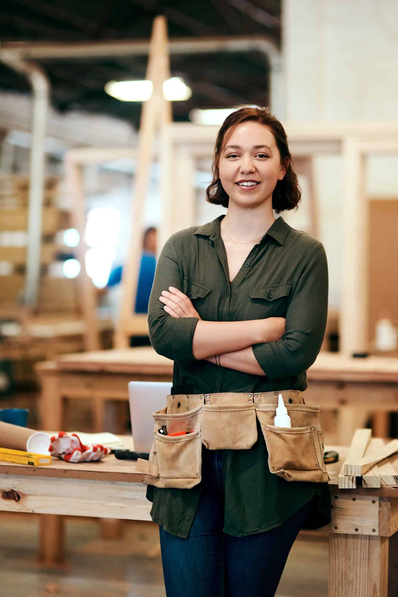 Cropped shot of a young female carpenter smiling at the camera